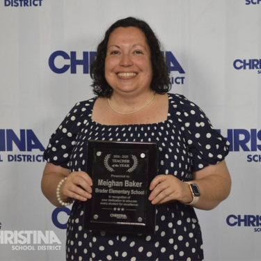 Photo of Meighan Baker with award